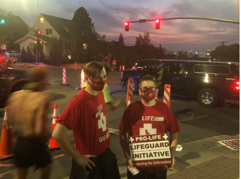 Police presence at a Lifeguard Initiative rally