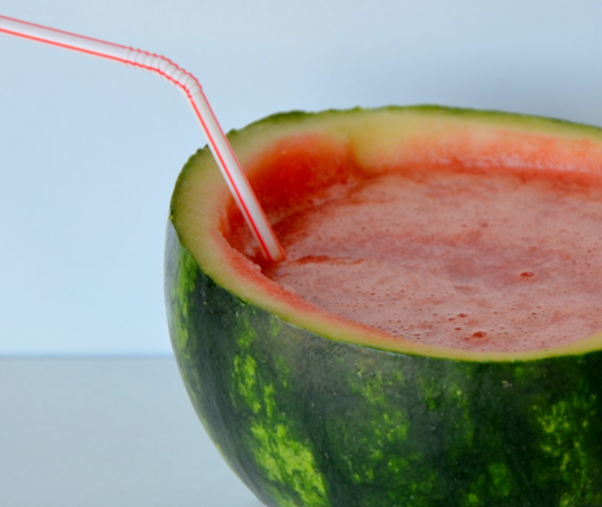 Watermelon drink with a straw used as a tube analogy