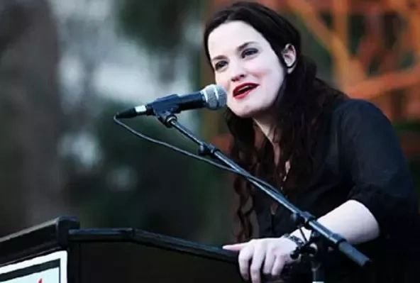 Gianna Jessen speaking into a microphone.